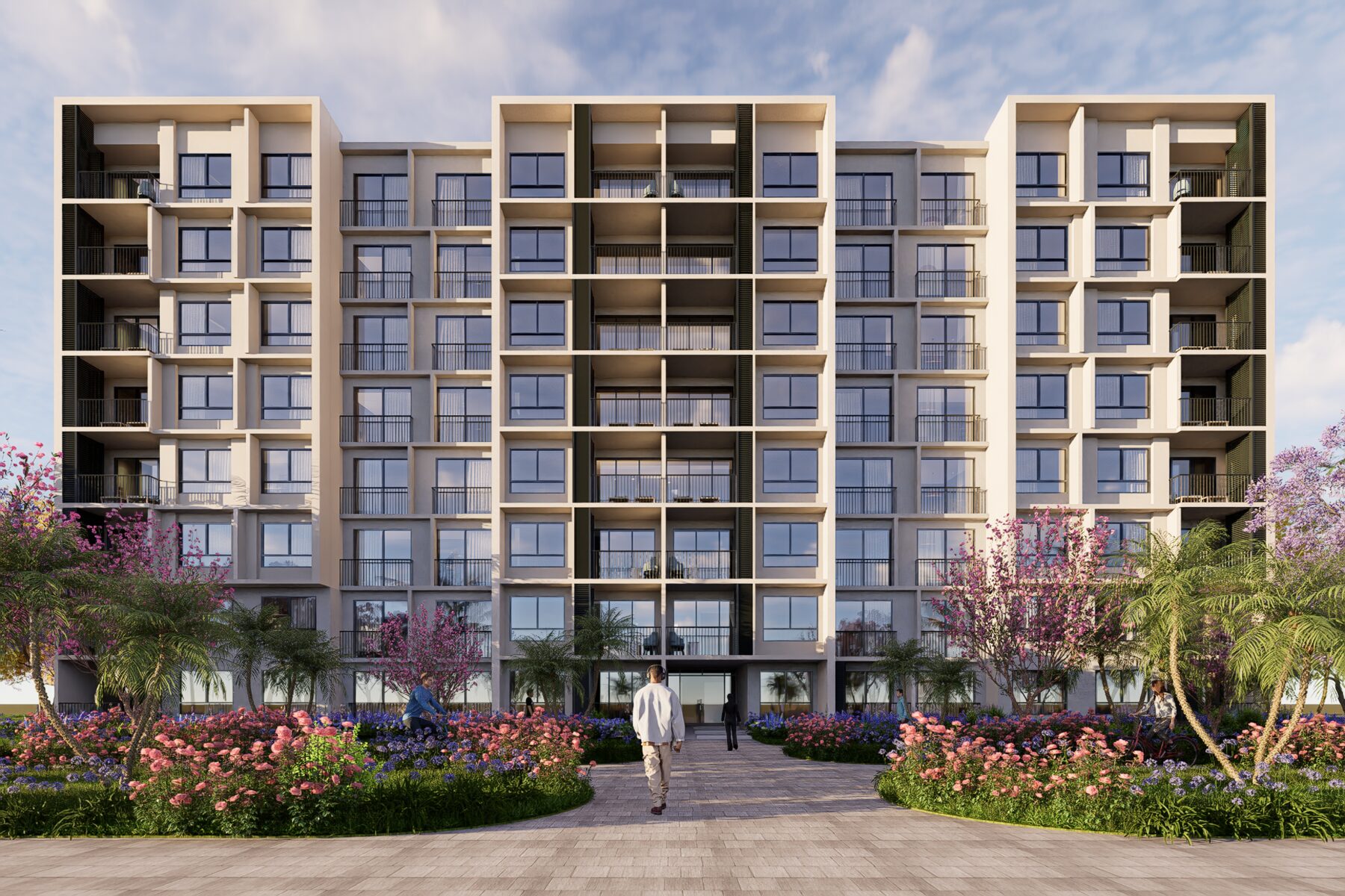 Fachada frontal del proyecto Costa Blanca en Boca Chica, edificios residenciales rodeados de jardines